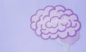 Fioletowy mózg z wykresami fal mózgowych, symbolizujący zdrowie psychiczne definicja.