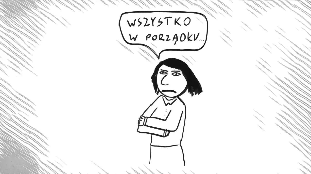 Kobieta z założonymi rękami mówi "Wszystko w porządku...", ale jej mina zdradza pasywną agresję.